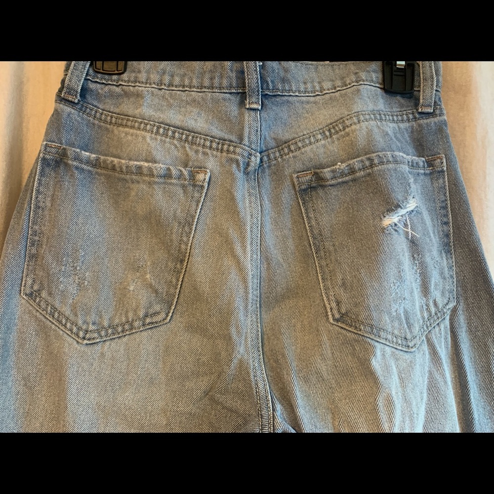high waisted ripped multi button mom jeans